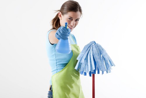 Professional cleaner preparing a property for a scheduled service
