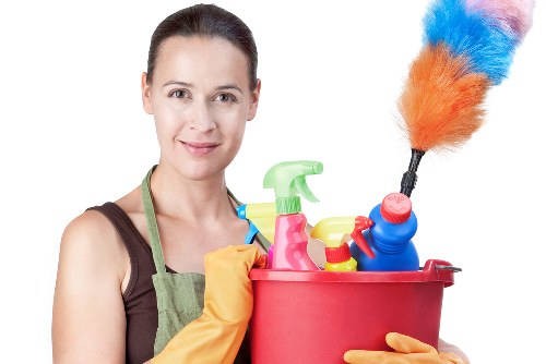 Cleaner carrying out a safe cleaning task with caution and awareness
