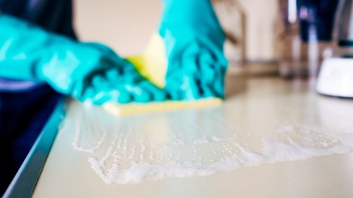 Detailed bathroom and kitchen cleaning during a move out service