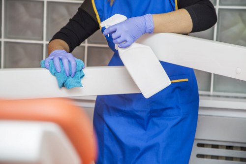Local technician carrying out deep sofa cleaning in a Streatham flat